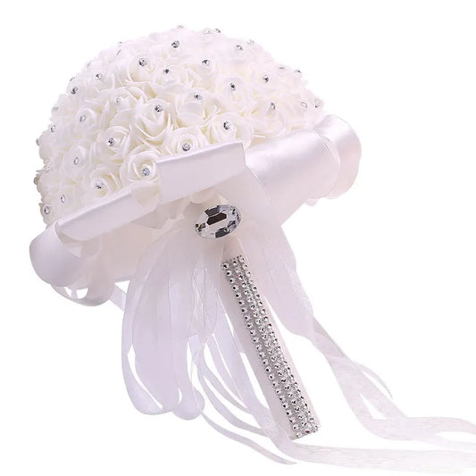 0053 A wedding bouquet of artificial white roses, a bride holding a bridesmaid bouquet of artificial flowers, and a wedding bouquet