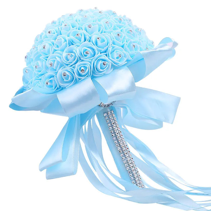 0053 A wedding bouquet of artificial white roses, a bride holding a bridesmaid bouquet of artificial flowers, and a wedding bouquet